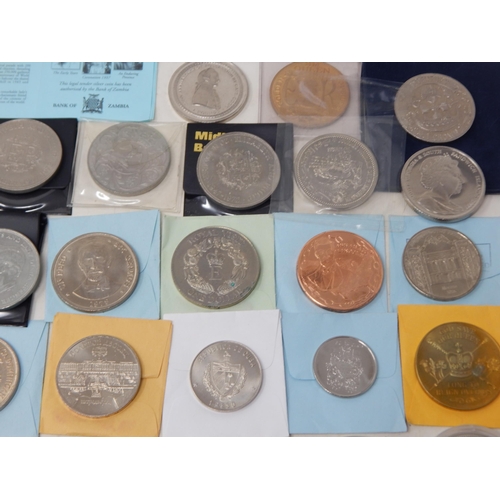 42 - A large quantity of Cupro Nickel Crown size and other denominations some coloured, many housed in ca... 