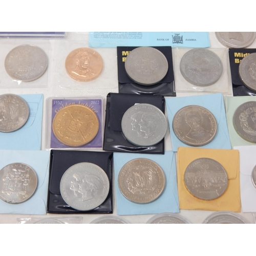 42 - A large quantity of Cupro Nickel Crown size and other denominations some coloured, many housed in ca... 