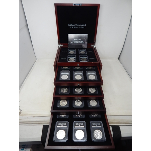 77 - Complete Collection of 28 Brilliant Uncirculated U.S Silver Dollars contained in a five drawer cabin... 