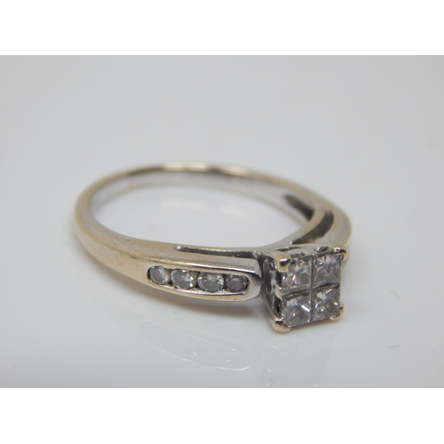 200 - 18ct White Gold Ring Set with Four Central Princess Cut Diamonds & Having Diamond Set Shoulders; Siz... 