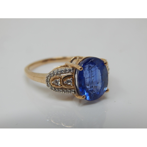 261 - 9ct Gold 5.23ct (Nilamani) Blue Sapphire & White Zircon Ring: Size N/O: Gross weight 3.96g