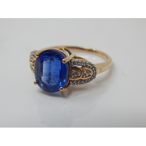 261 - 9ct Gold 5.23ct (Nilamani) Blue Sapphire & White Zircon Ring: Size N/O: Gross weight 3.96g