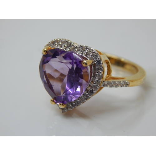 264 - Gold on Silver Ring set with a Heart Shaped 7.48ct Amethyst & White Zircons: Ring Size N/O: Gross we... 