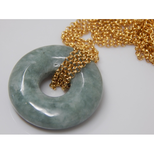 266 - Green Jadeite Circular Pendant on Gold on Silver Neck Chain.