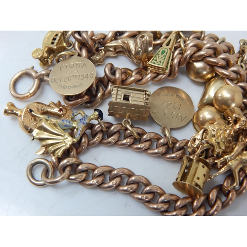 430 - 9ct Gold Charm Bracelet with Attached Charms: Weight 99.02g