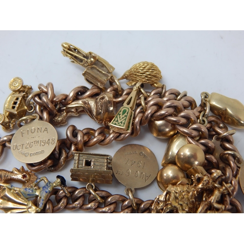 430 - 9ct Gold Charm Bracelet with Attached Charms: Weight 99.02g