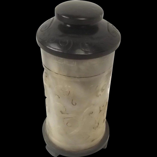Chinese Qing Dynasty Nephrite Jade Cylindrical Lidded Brush Pot ~
A hand carved jade cylindrical vessel with lid, it dates to Qing Dynasty or earlier.
There are carvings of mythical creatures and other decorations around the pot.
The nephrite jade is a light grey in colour while the lid and bottom are of black jade.
~ Dimensions ~
The base has a diameter of 3 inches (7.2 cm), the height with the lid measures 5.75 inches (14.8 cm) & the height without the lid measures 4.75 inches (12 cm).
It weighs 530g
~ Condition ~
The piece is in great condition with no cracks or chips