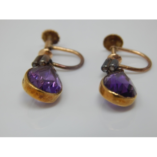 15 - A Pair of Edwardian Unmarked Gold Amethyst & Diamond Set Screw Back Earrings: Gross weight 4.0g