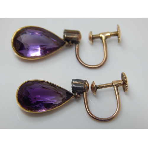 15 - A Pair of Edwardian Unmarked Gold Amethyst & Diamond Set Screw Back Earrings: Gross weight 4.0g