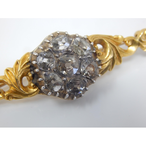 17 - Victorian Unmarked Gold Brooch Set with Seven Old Cut Diamonds Estimated @ 3.00cts Total: Width 48mm... 
