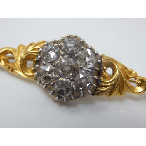 17 - Victorian Unmarked Gold Brooch Set with Seven Old Cut Diamonds Estimated @ 3.00cts Total: Width 48mm... 