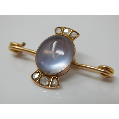 19 - Victorian Unmarked Gold Brooch Set with a central Moonstone 12mm x 10mm & Six Old Cut Diamonds: Widt... 