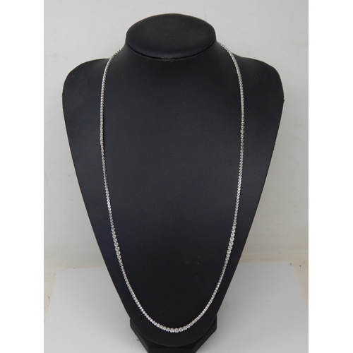 91 - A Long 18ct White Gold  Diamond Line Necklace, set throughout with Brilliant Cut Diamonds, stamped ‘... 