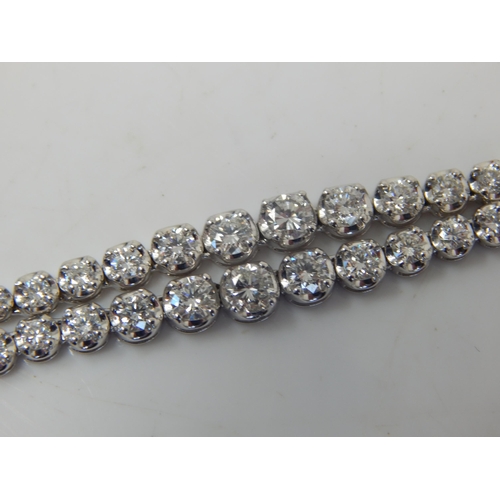 91 - A Long 18ct White Gold  Diamond Line Necklace, set throughout with Brilliant Cut Diamonds, stamped ‘... 