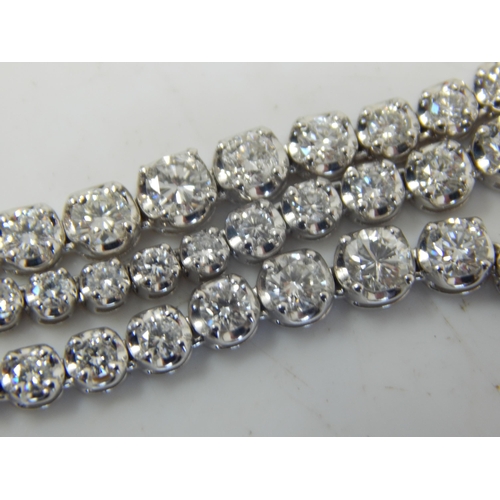 91 - A Long 18ct White Gold  Diamond Line Necklace, set throughout with Brilliant Cut Diamonds, stamped ‘... 