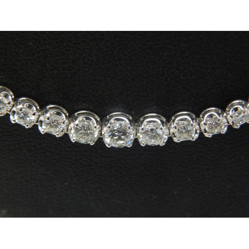 91 - A Long 18ct White Gold  Diamond Line Necklace, set throughout with Brilliant Cut Diamonds, stamped ‘... 
