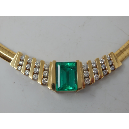 92 - An 18ct Gold Colombian Emerald & Diamond Necklace Set with a 7.00ct Cut Cornered Octagonal Step Cut ...