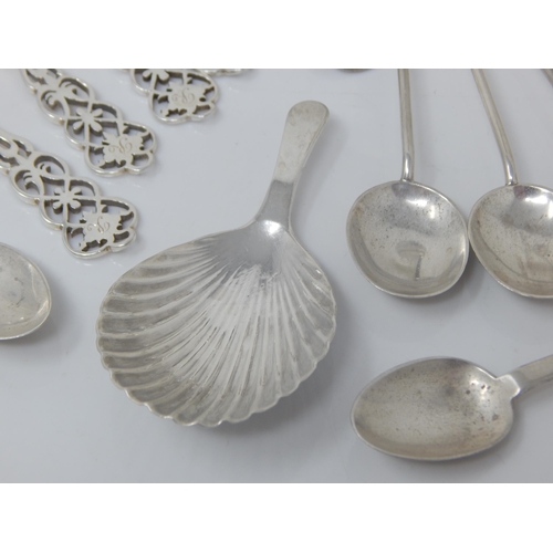 116 - A Quantity of Hallmarked Silver Spoons, Caddy Spoon & Tongs: Various Dates & Makers: Weight 150g tog... 