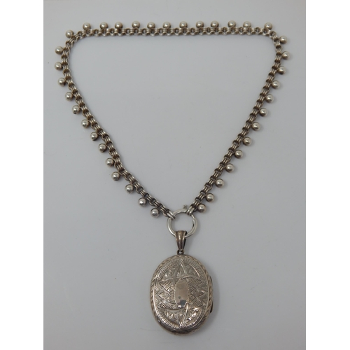 119 - Victorian Silver Locket & Chain 42cm: Locket contains a photograph of the lady wearing the item: