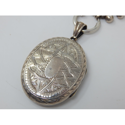 119 - Victorian Silver Locket & Chain 42cm: Locket contains a photograph of the lady wearing the item: