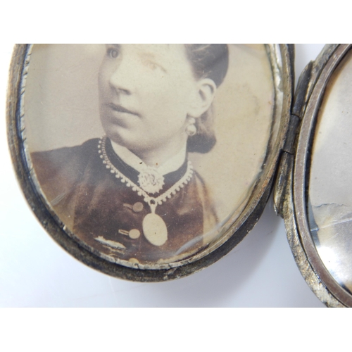 119 - Victorian Silver Locket & Chain 42cm: Locket contains a photograph of the lady wearing the item: