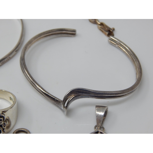 120 - A Quantity of Silver Jewellery Including Bangles, Pendant, Rings etc (lot) Weight 148g
