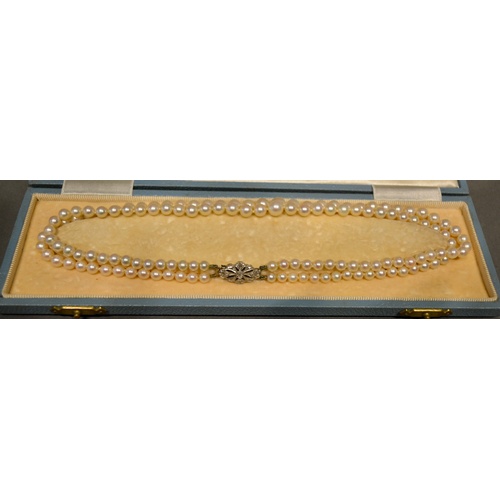 123 - A Double Row Cultured Pearl Necklace, the platinum clasp set with diamonds