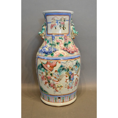 24 - A 19th Century Canton Vase decorated in polychrome enamels with figures within landscapes, 34cm tall