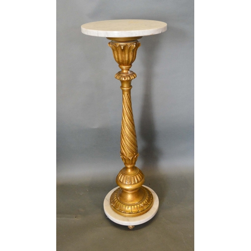 575 - A French Carved Giltwood and Variegated Marble Torchere with a spiral twist column and circular plat... 