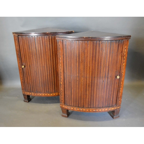 576 - A Pair of 19th Century Mahogany and Marquetry Inlaid Corner Cabinets, each with a ribbed panel door ... 