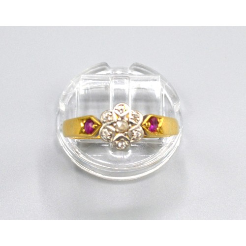 180 - A 18ct Yellow Gold Diamond Cluster Ring set with seven diamonds within a cluster and with ruby shoul... 