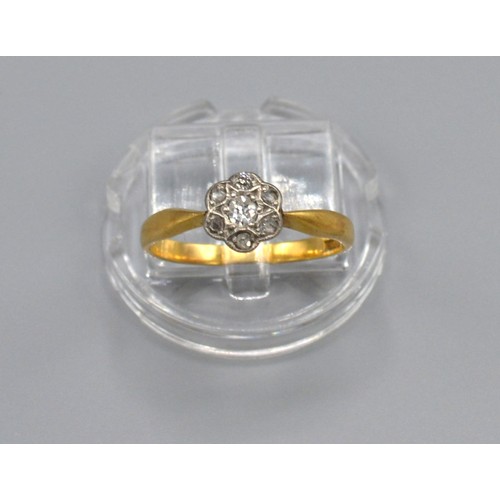 182 - A 18ct Yellow Gold Diamond Cluster Ring set with seven diamonds within a pierced setting, Size M, 2.... 