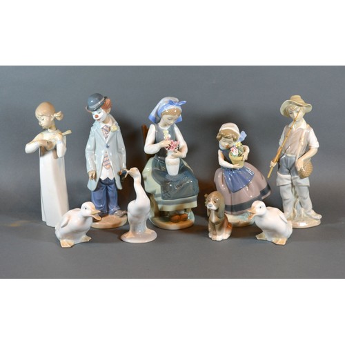 2 - A Lladro Figurine of a Seated Girl with a Vase of Flowers, together with four other Lladro figures, ... 