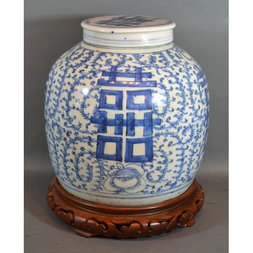 9 - A 19th Century Chinese Large Covered Ginger Jar decorated in underglaze blue with pierced hardwood s... 