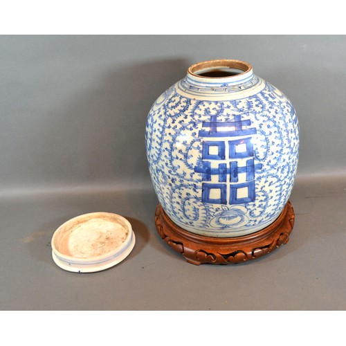 9 - A 19th Century Chinese Large Covered Ginger Jar decorated in underglaze blue with pierced hardwood s... 