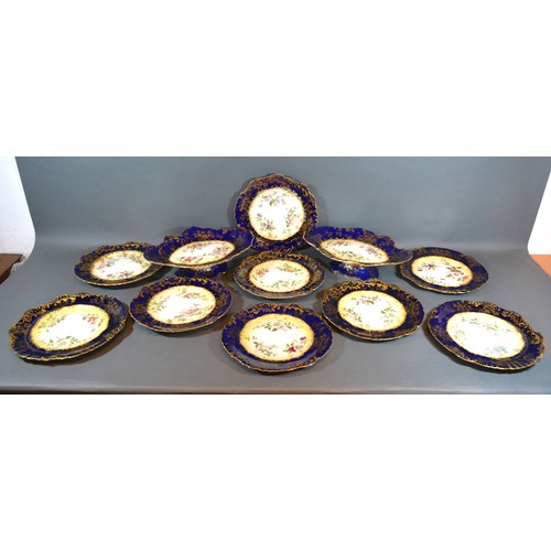 25 - A Hammersley Dessert Service comprising a pair of comports and nine plates all hand painted with flo... 