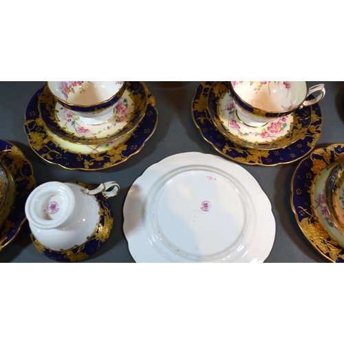 26 - A Hammersley Porcelain Tea Service comprising eleven cups, ten saucers, eleven plates, two serving p... 