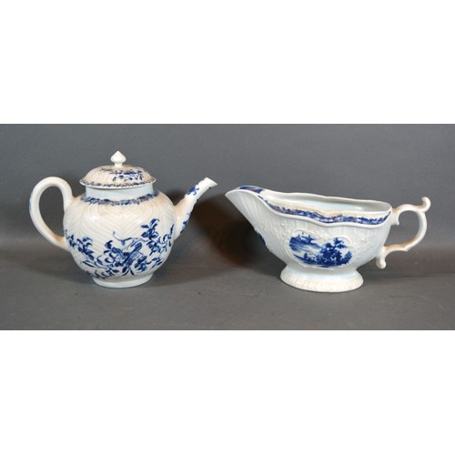 35 - A First Period Worcester Sauce Jug decorated in underglaze blue with a reserve together with a simil... 