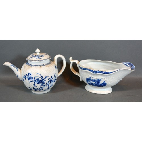 35 - A First Period Worcester Sauce Jug decorated in underglaze blue with a reserve together with a simil... 