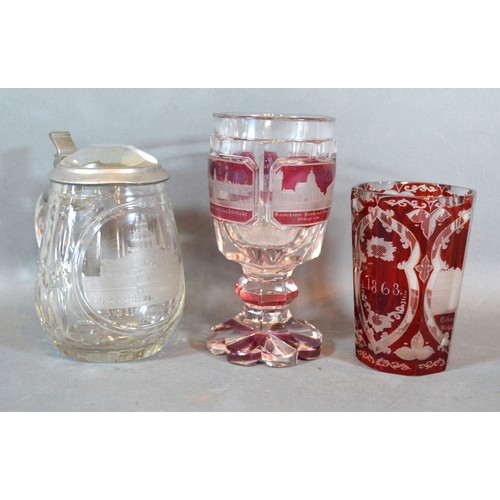 43 - A Bohemian Ruby Glass Beaker together with a similar Goblet and a clear glass lidded Tankard