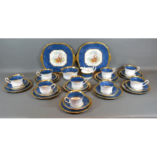 46 - A Fenton Porcelain Tea Service comprising nine cups and saucers, nine plates, a pair of dishes, crea... 