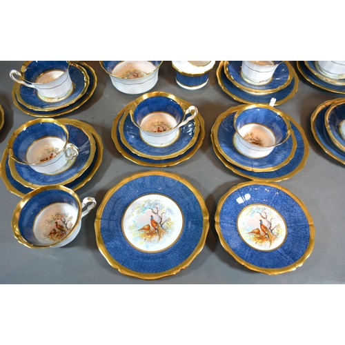 46 - A Fenton Porcelain Tea Service comprising nine cups and saucers, nine plates, a pair of dishes, crea... 