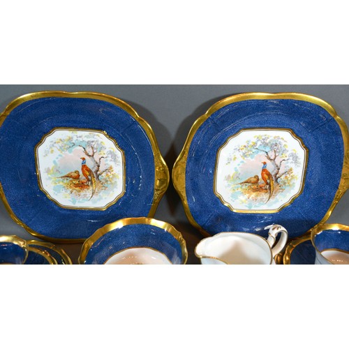 46 - A Fenton Porcelain Tea Service comprising nine cups and saucers, nine plates, a pair of dishes, crea... 