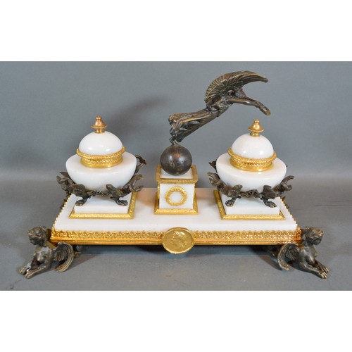 376 - A French Style Ormolu, Bronze and Marble Ink Stand with winged figure and raised upon griffin suppor... 