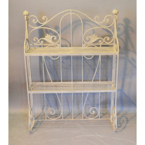 532 - A Wrought Iron Garden Plant Stand of shaped scroll form 93cm by 22cm and 122cm tall