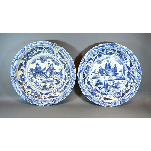 70 - A Pair of Chinese Underglaze Blue Decorated Large Chargers, each decorated with figures within lands... 