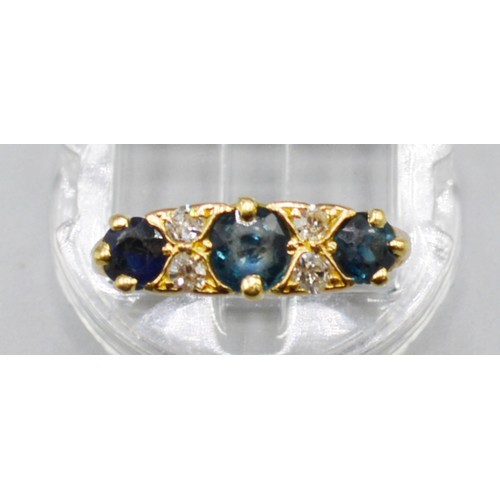 256 - An 18ct Gold Sapphire And Diamond Ring, set with three Sapphire and four diamonds, 4 grams, ring siz... 