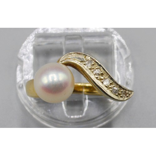 258 - A Yellow Metal Dress Ring, set with a band of diamonds and single pearl, 5.8 grams, ring size K