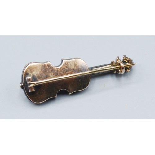 265 - A yellow Metal Brooch In The Form Of A Violin, set with many diamonds, 5.5 grams, 3.5cms long