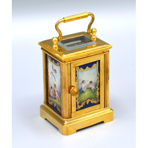 417 - A Brass Cased Carriage Clock, the silvered dial with circular enamel face and with porcelain side pa... 